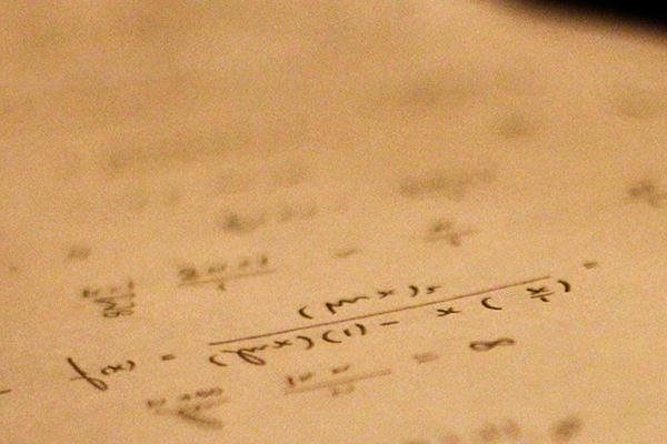 数学 formulas written on a piece of paper